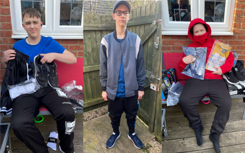 Photos of all three boys with their new grant items. The boys are white teenagers, photographed in a back garden, next to a fence and paving. The first boy is seventeen and has black jogging bottoms and a blue t-shirt. He is holding a pair of black a