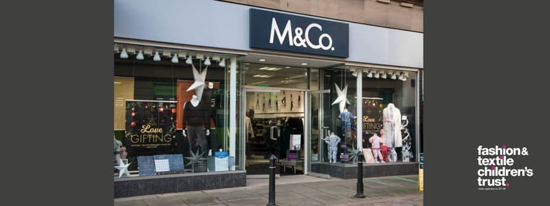 A picture of a M&Co shop on a high street.
